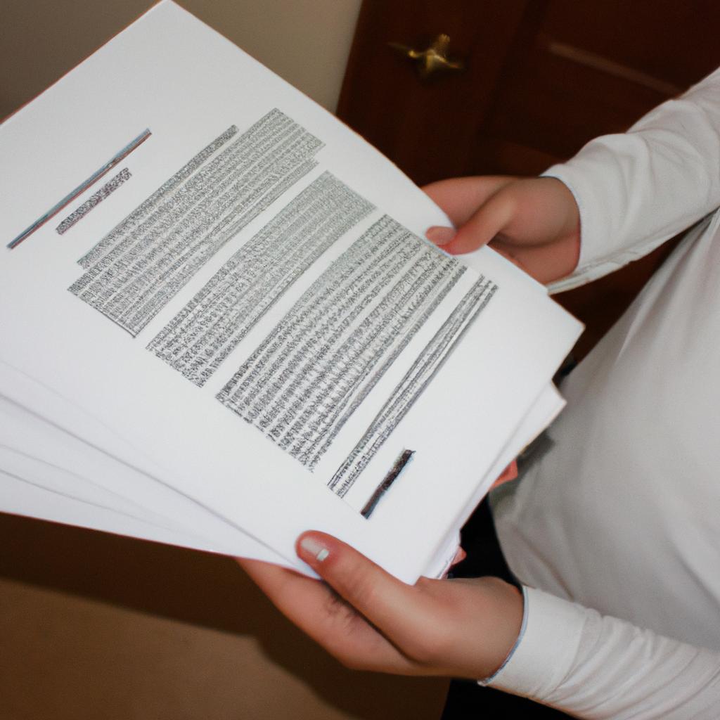Person holding legal documents, reading